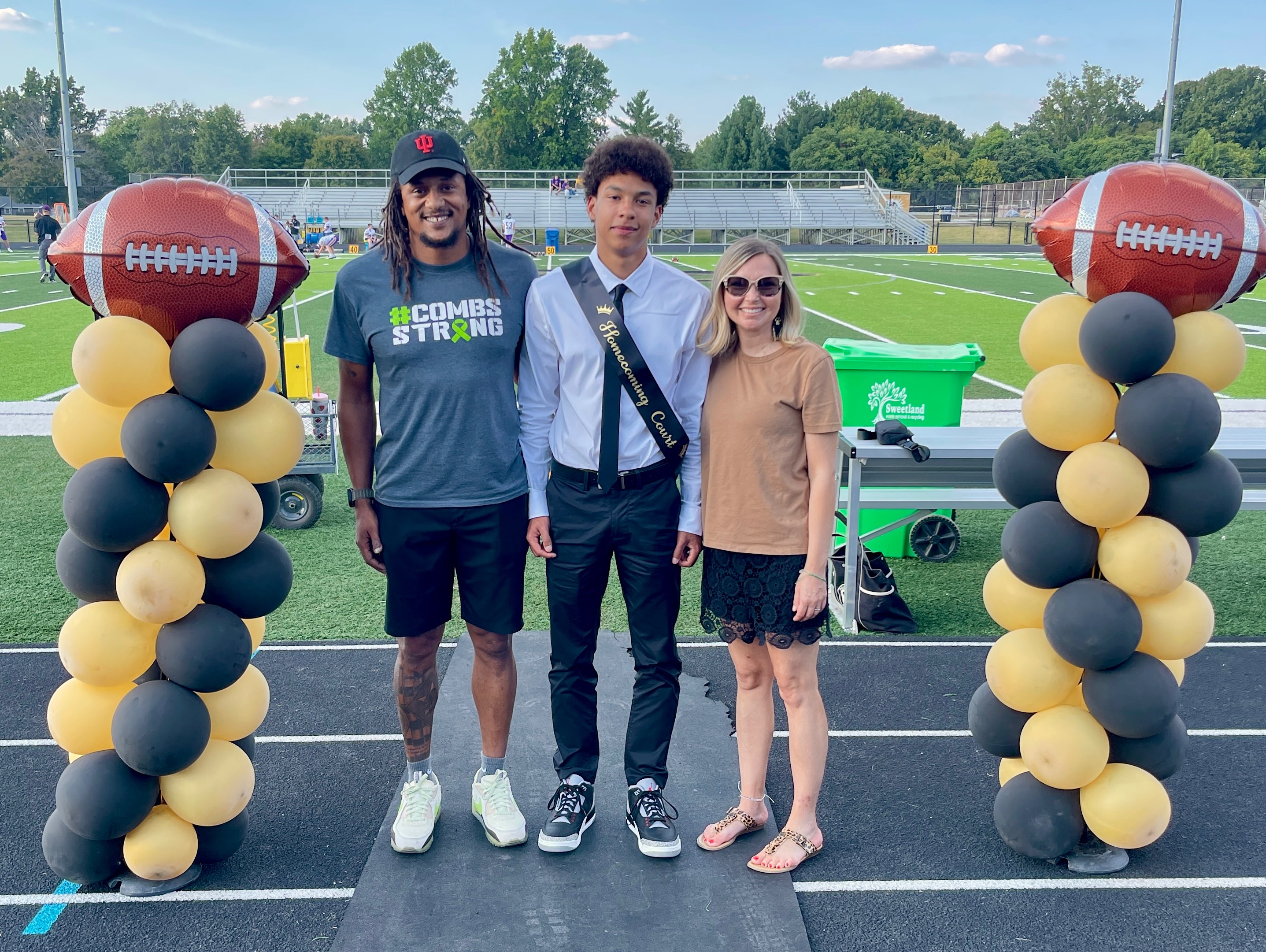 The family at a homecoming football game