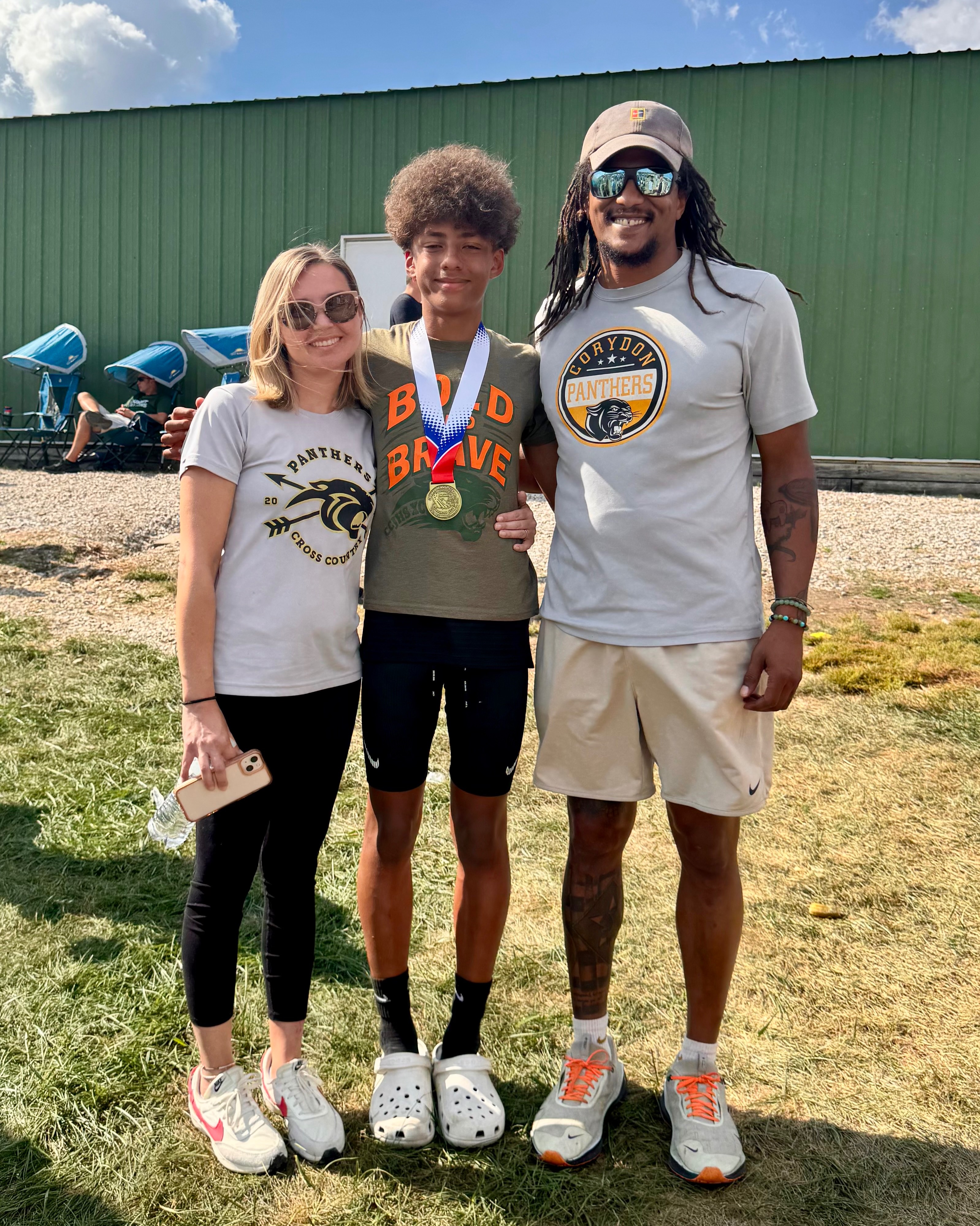 Quentin and Kristina with their son after a track meet
